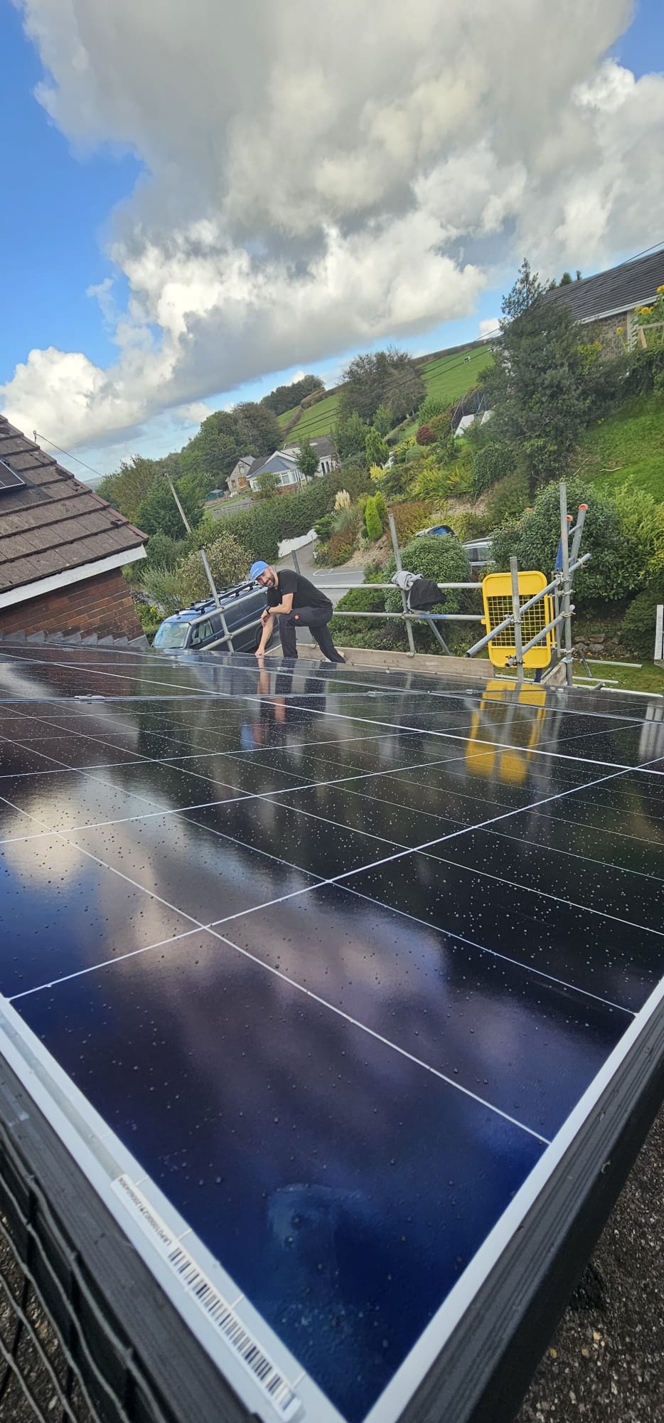 Phil installing solar panels on a rooftop